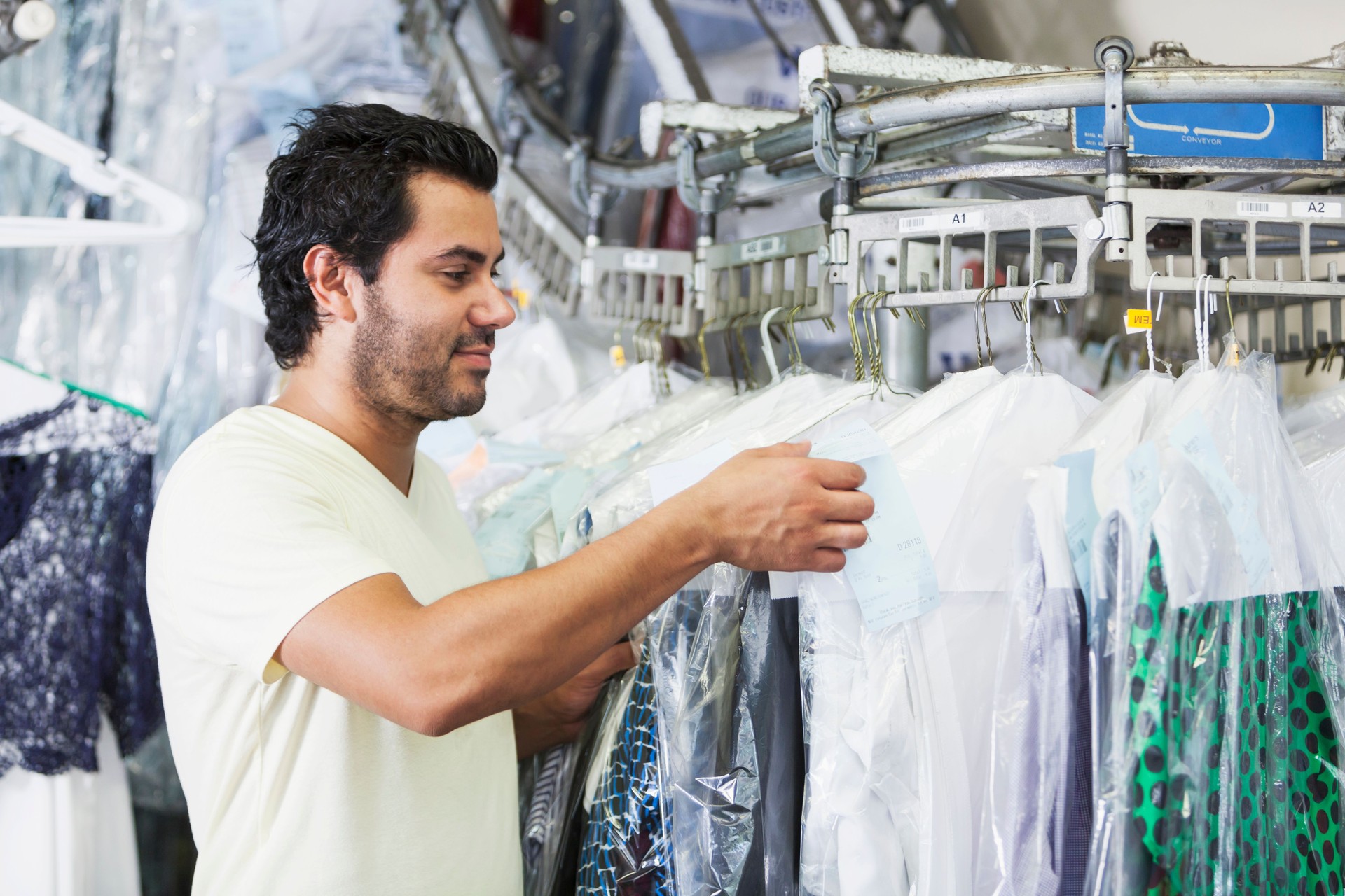 Hispanic man working in dry cleaners